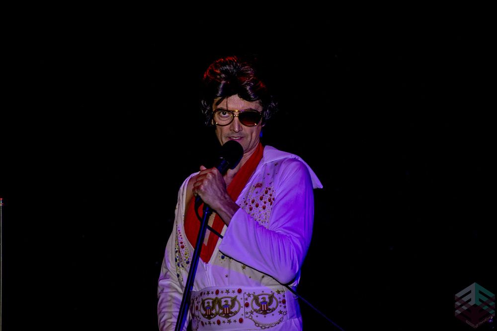 Elvis character at the mic